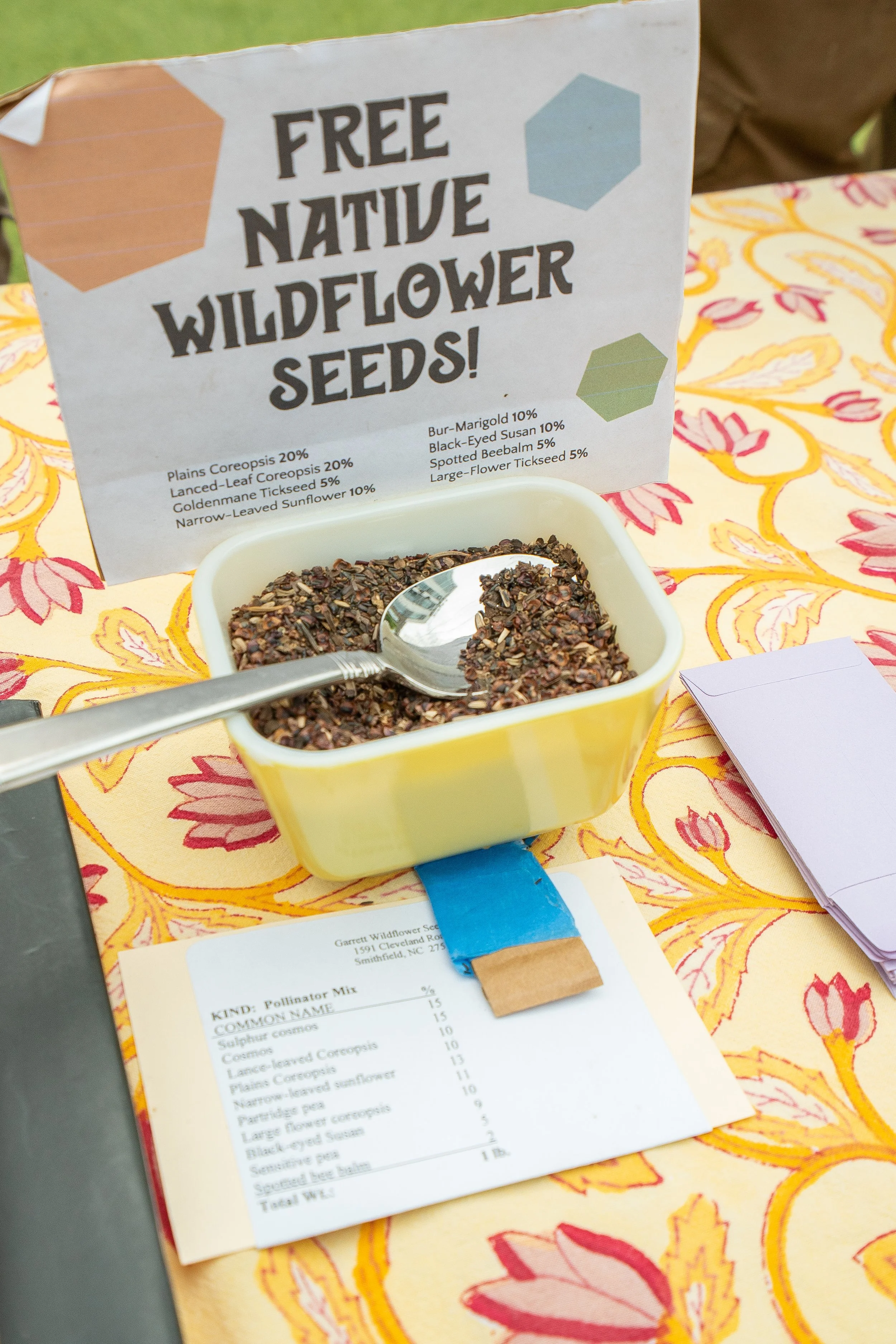 Free native wildflower seed mix at a Buddha Bee event table