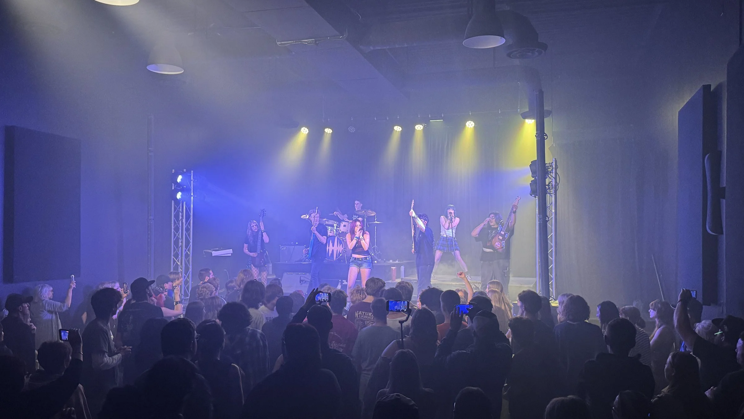 A Soundhouse band performing to a full room at the Pleasant Grove studio.