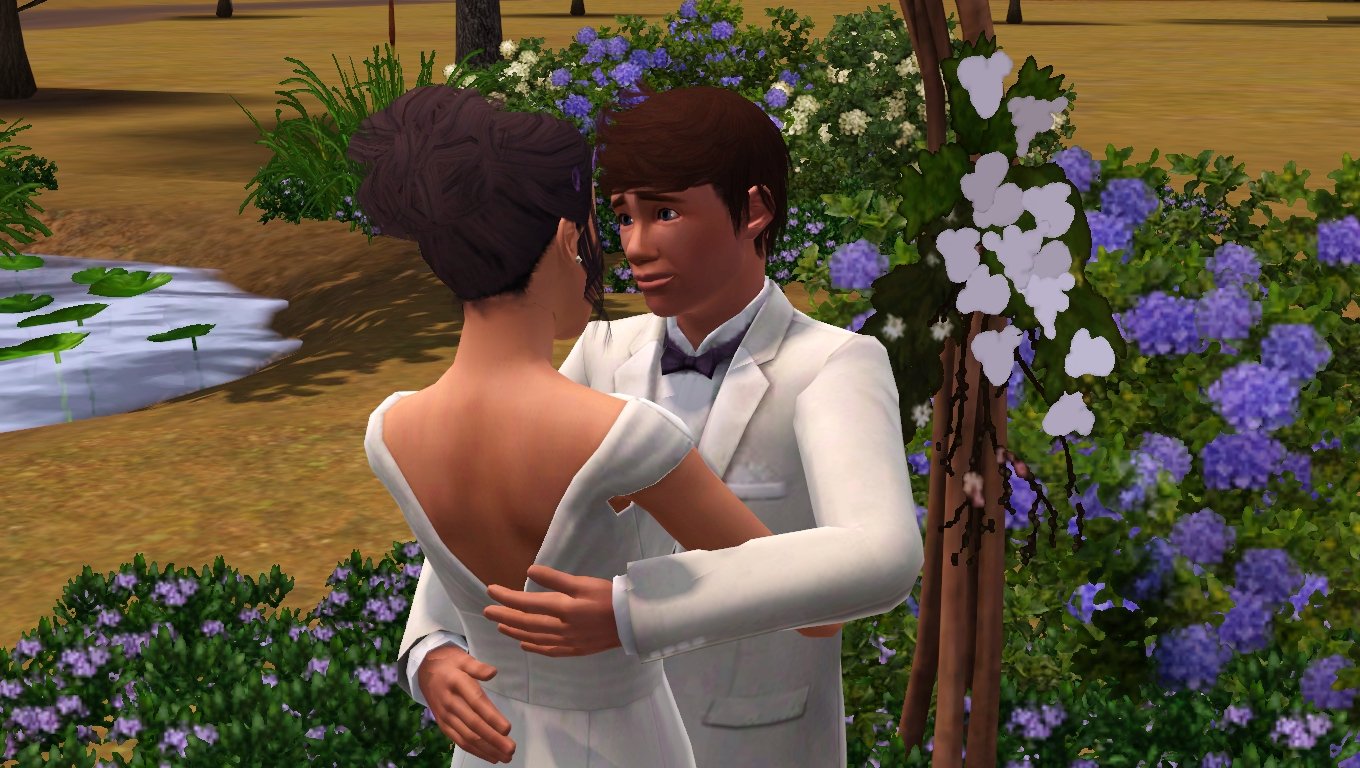Matthew lovingly looks at Dorothy as they hold each other in their wedding outfits