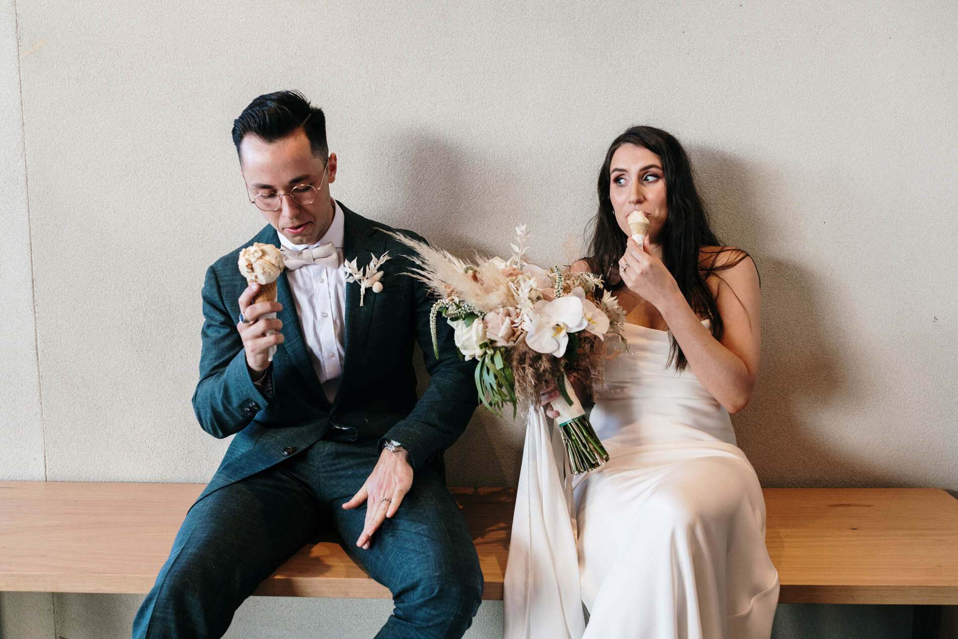 Couple sharing gelato on a bench — a simple, real moment from a registry wedding