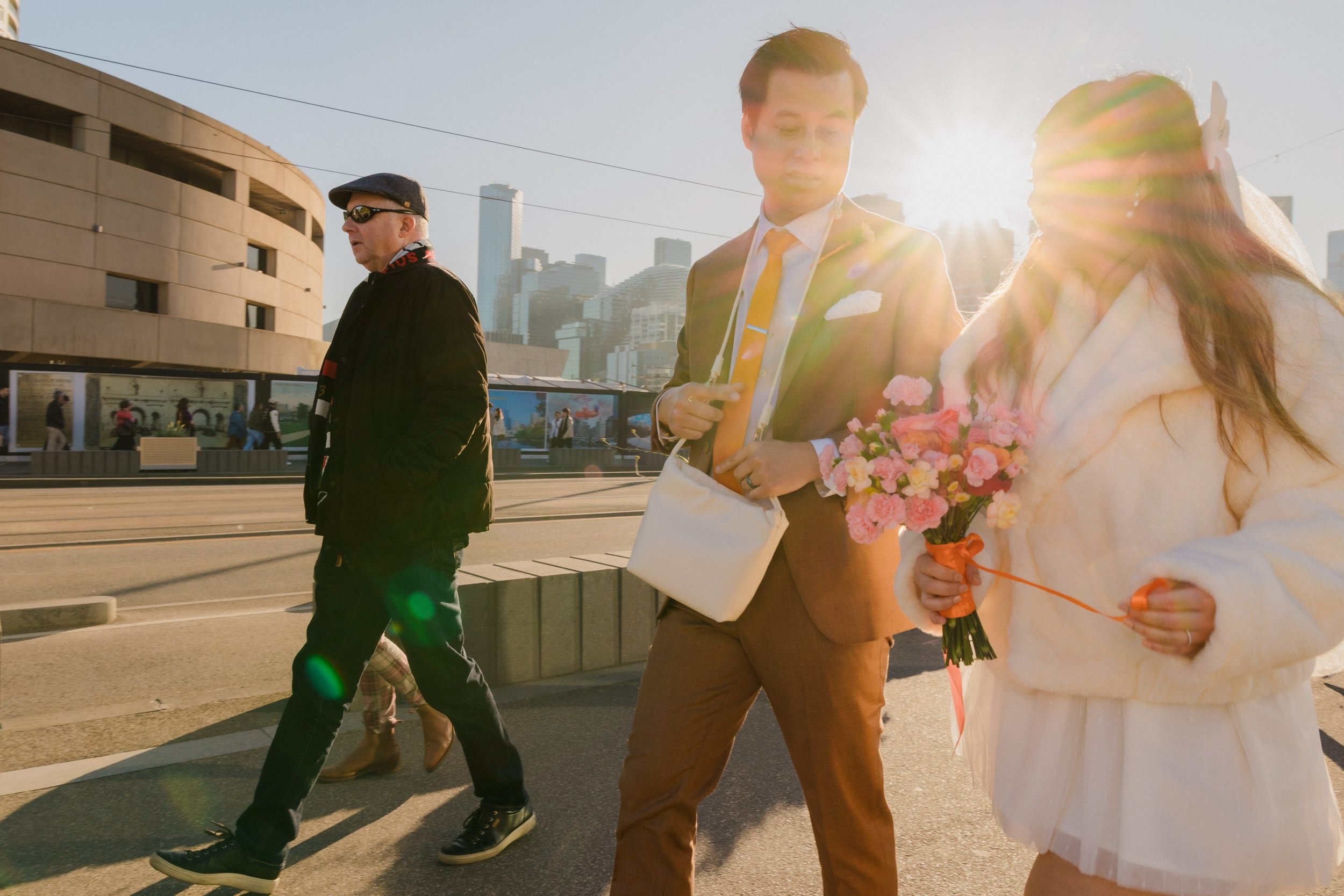 Couple laughing against a bright colourful background — bold colour, pure joy