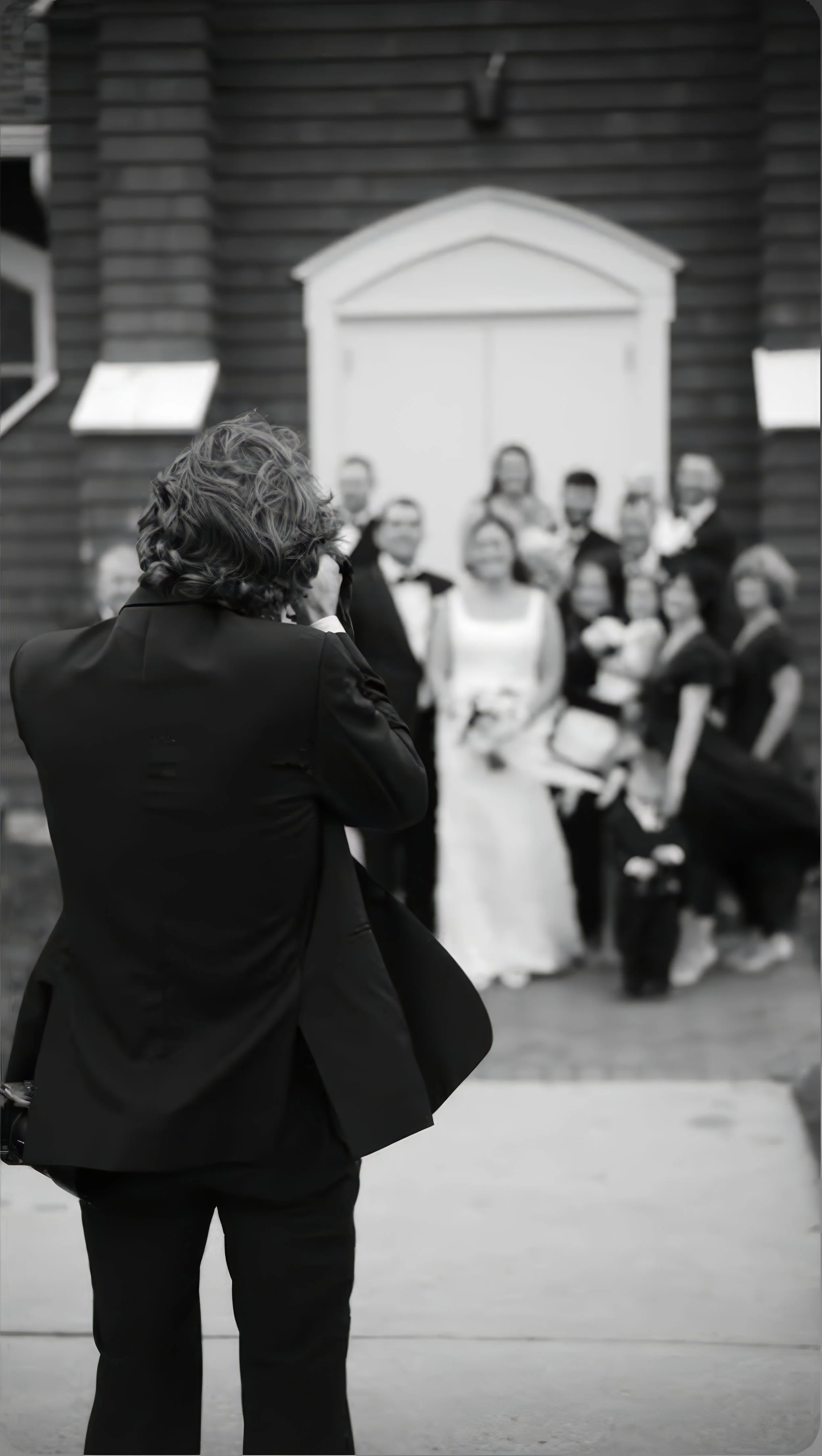 Michael Justin photographing a wedding party