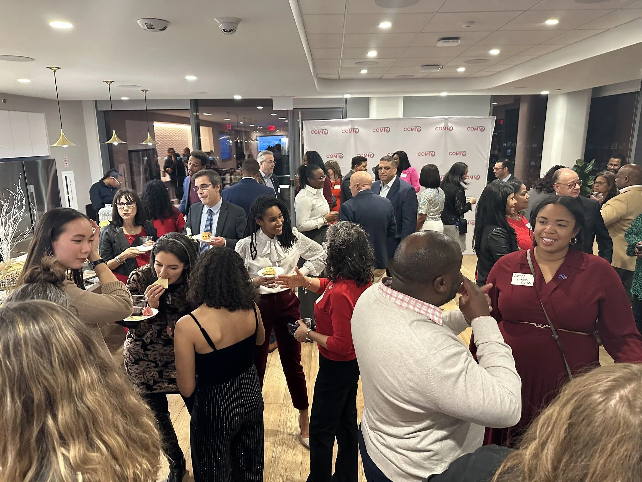 Transportation professionals networking at a COMTO DC event