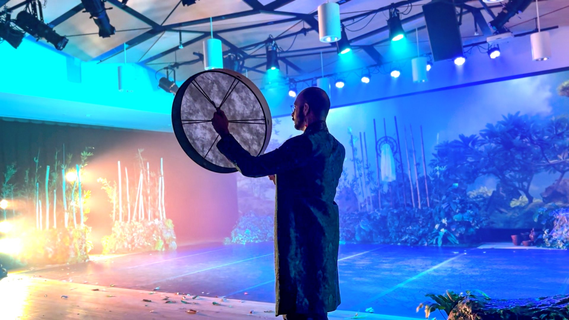 Navaji performing the KOMOREBI pre-show soundscape with a drum