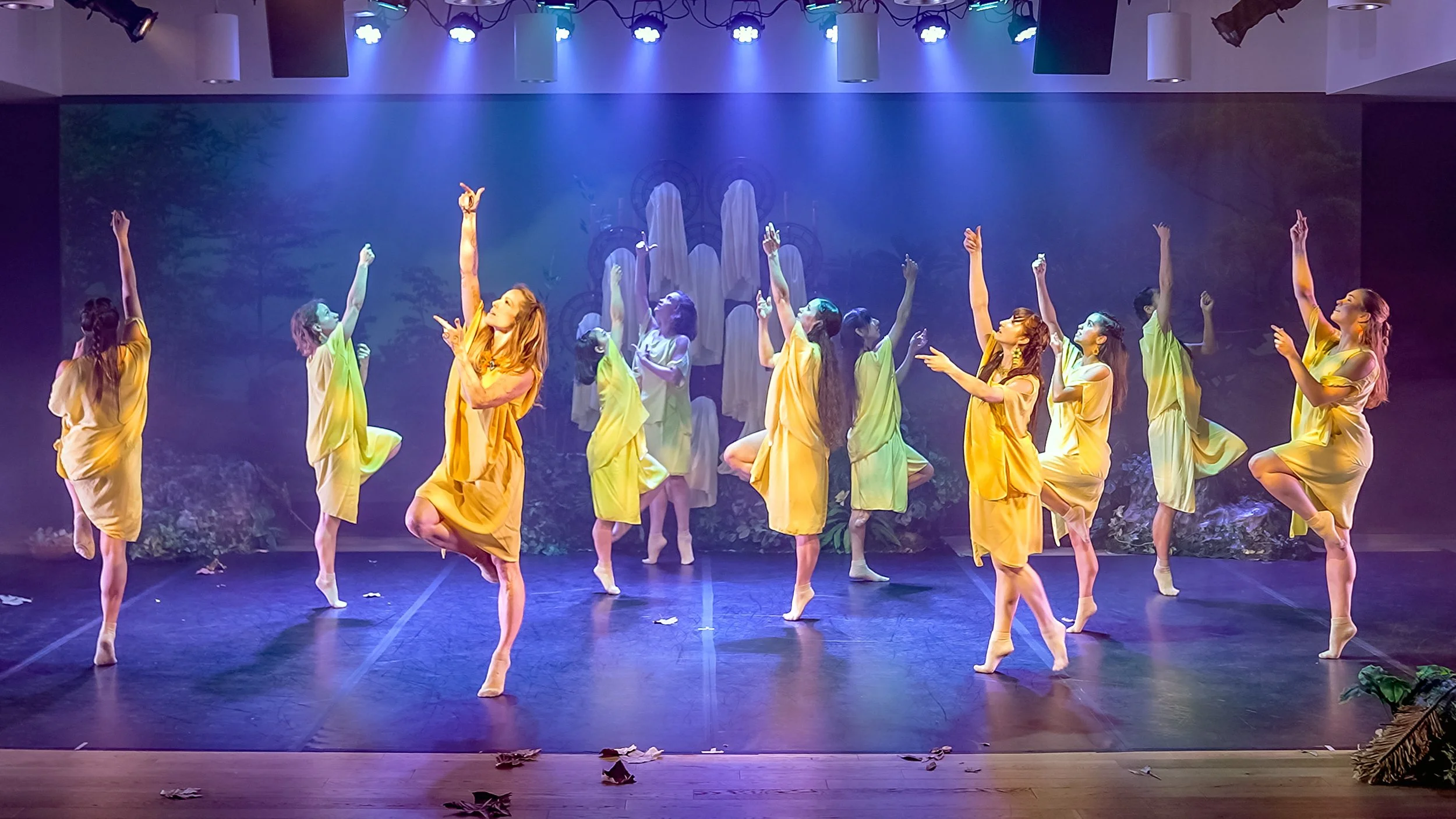 The full cast of KOMOREBI performing onstage