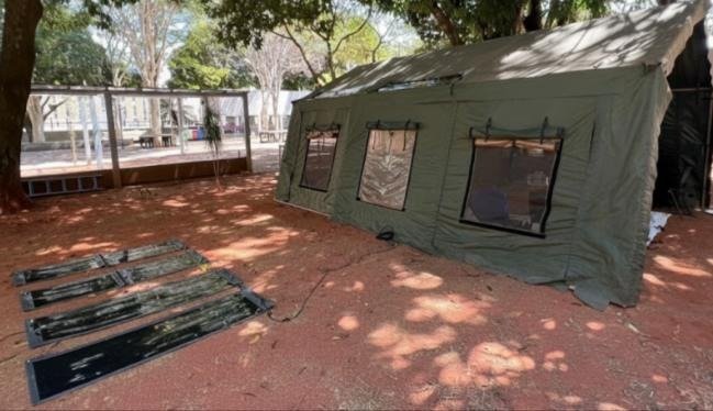 ORENgE flexible panels deployed beside a field tent