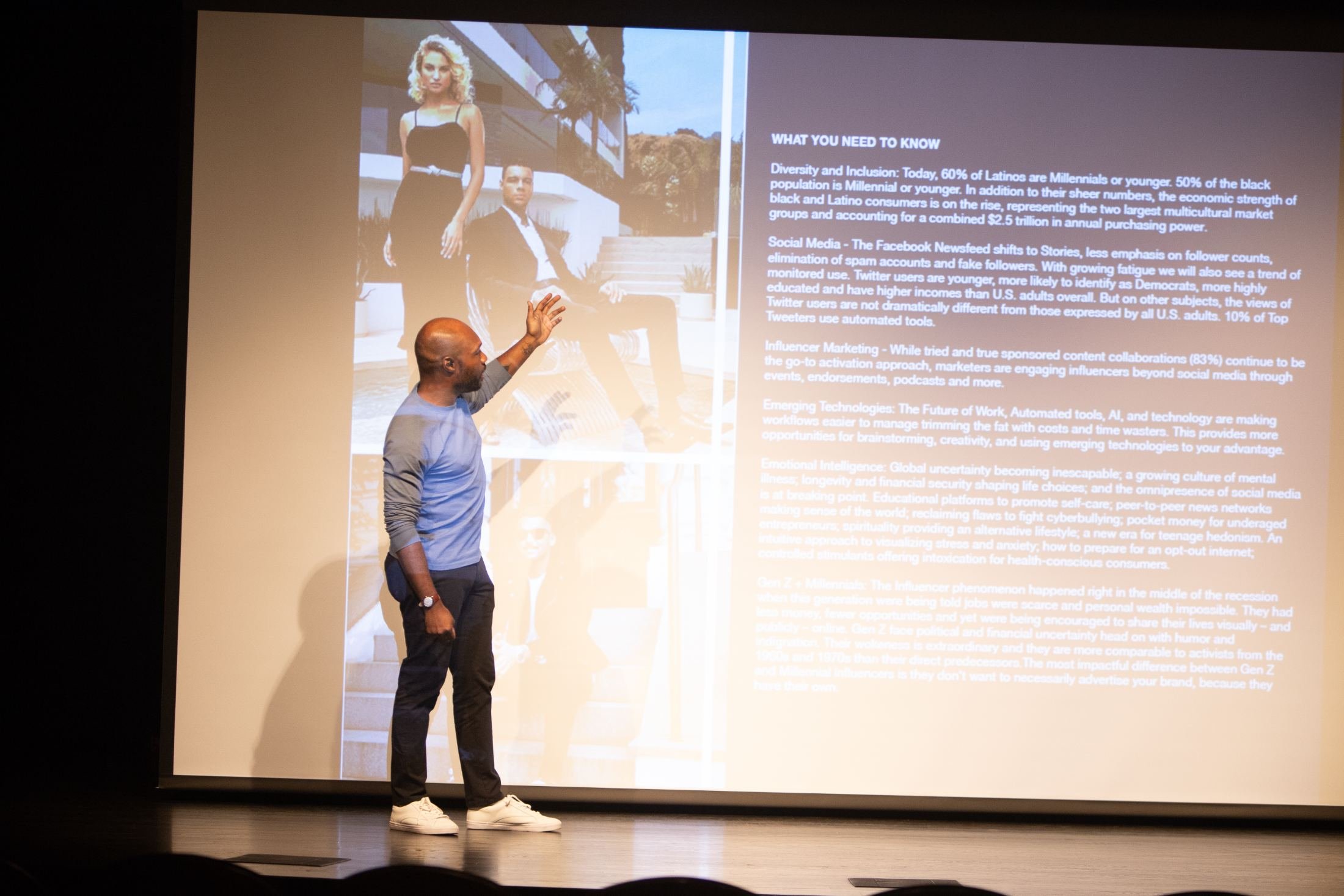 CJ Johnson presenting on stage at the Columbus Black International Film Festival