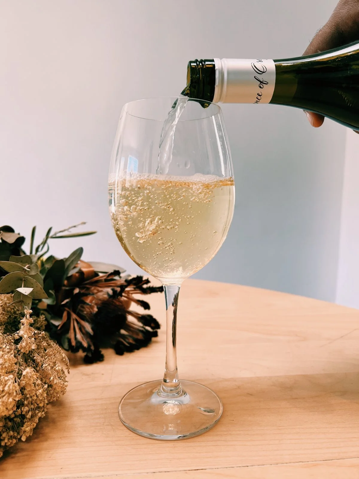 White wine being poured into a glass, Naked Wines