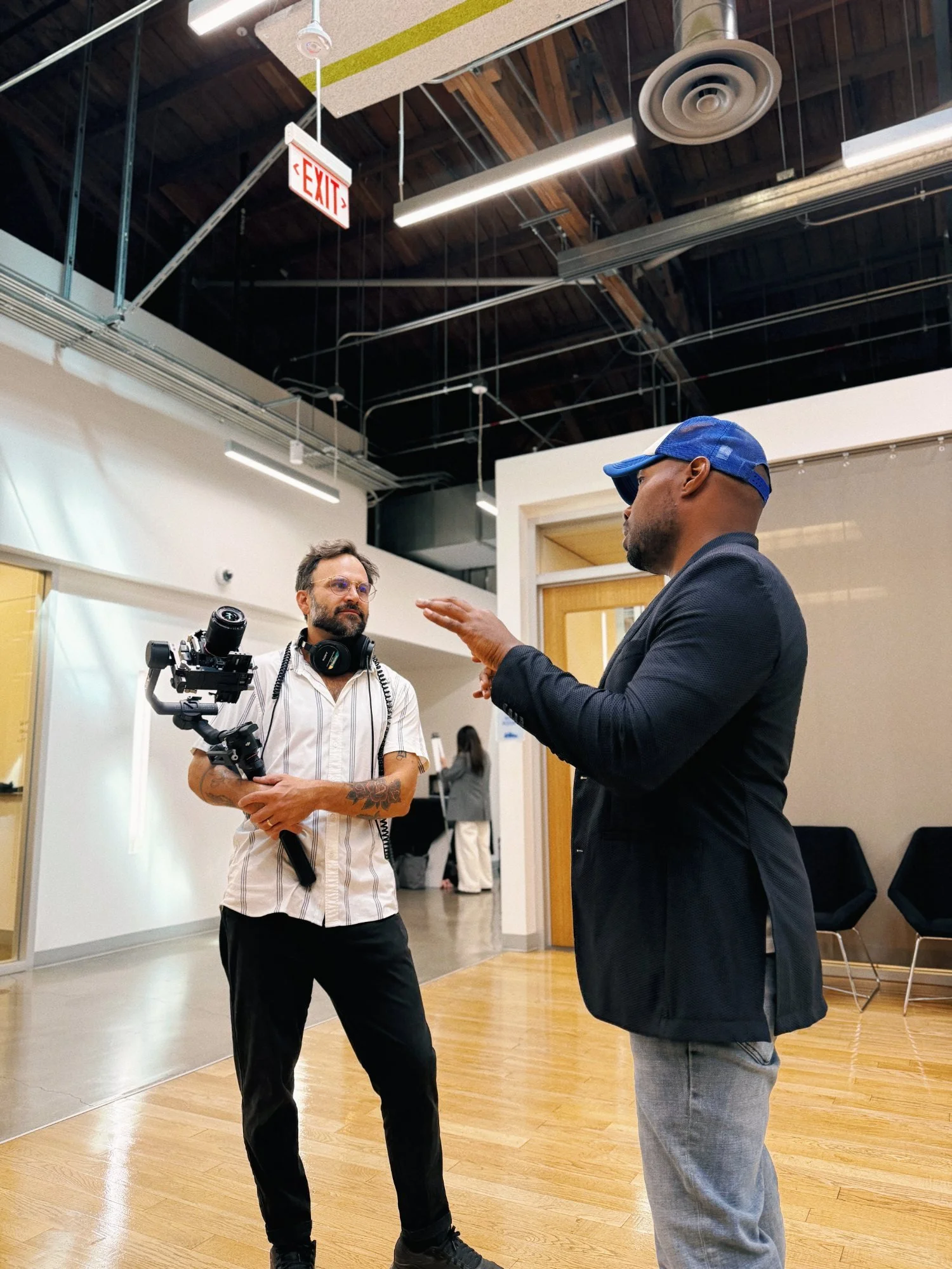 CJ Johnson directing a camera operator on a Rogue Dynamics shoot