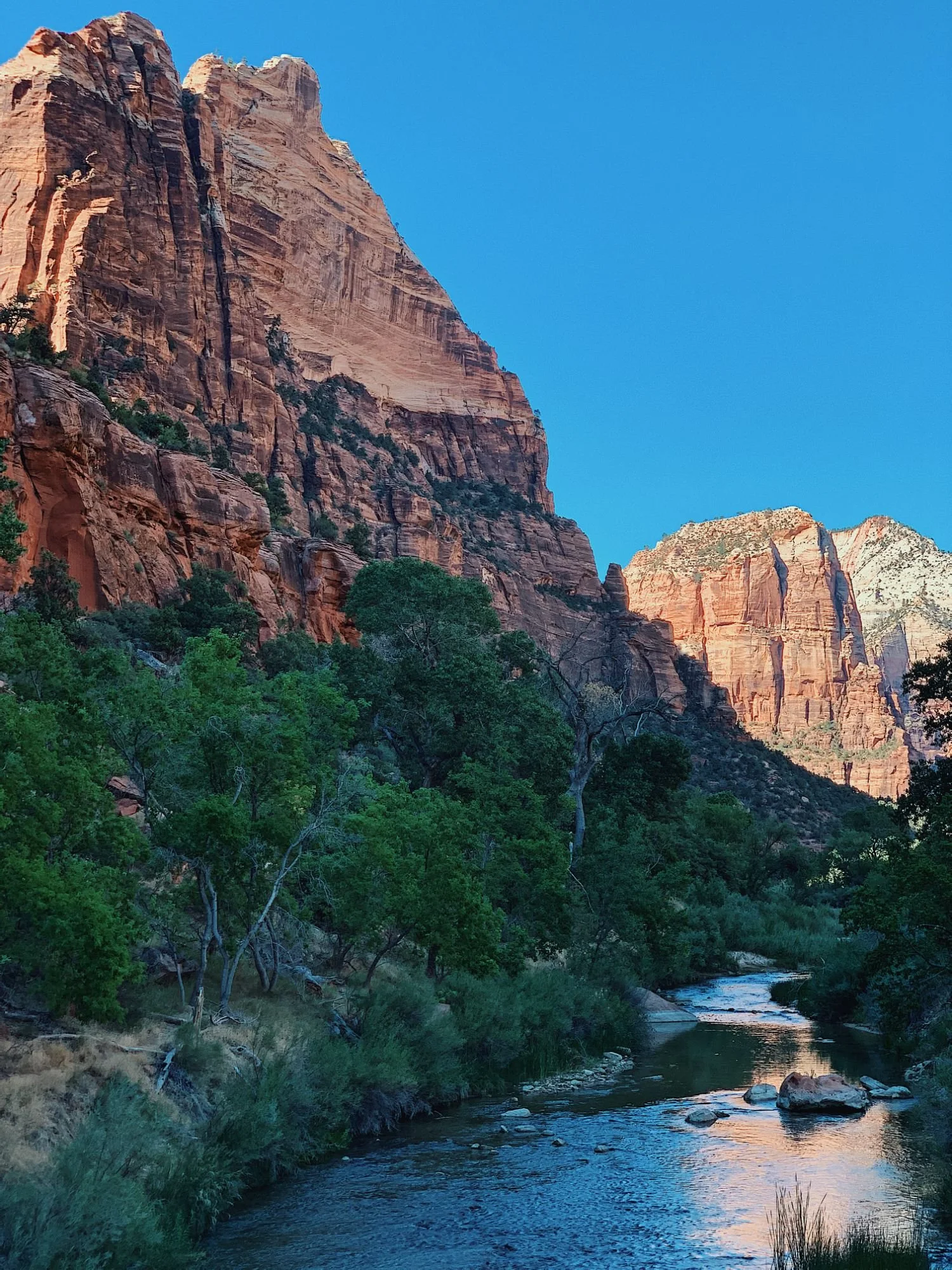 Red canyon walls above a winding river