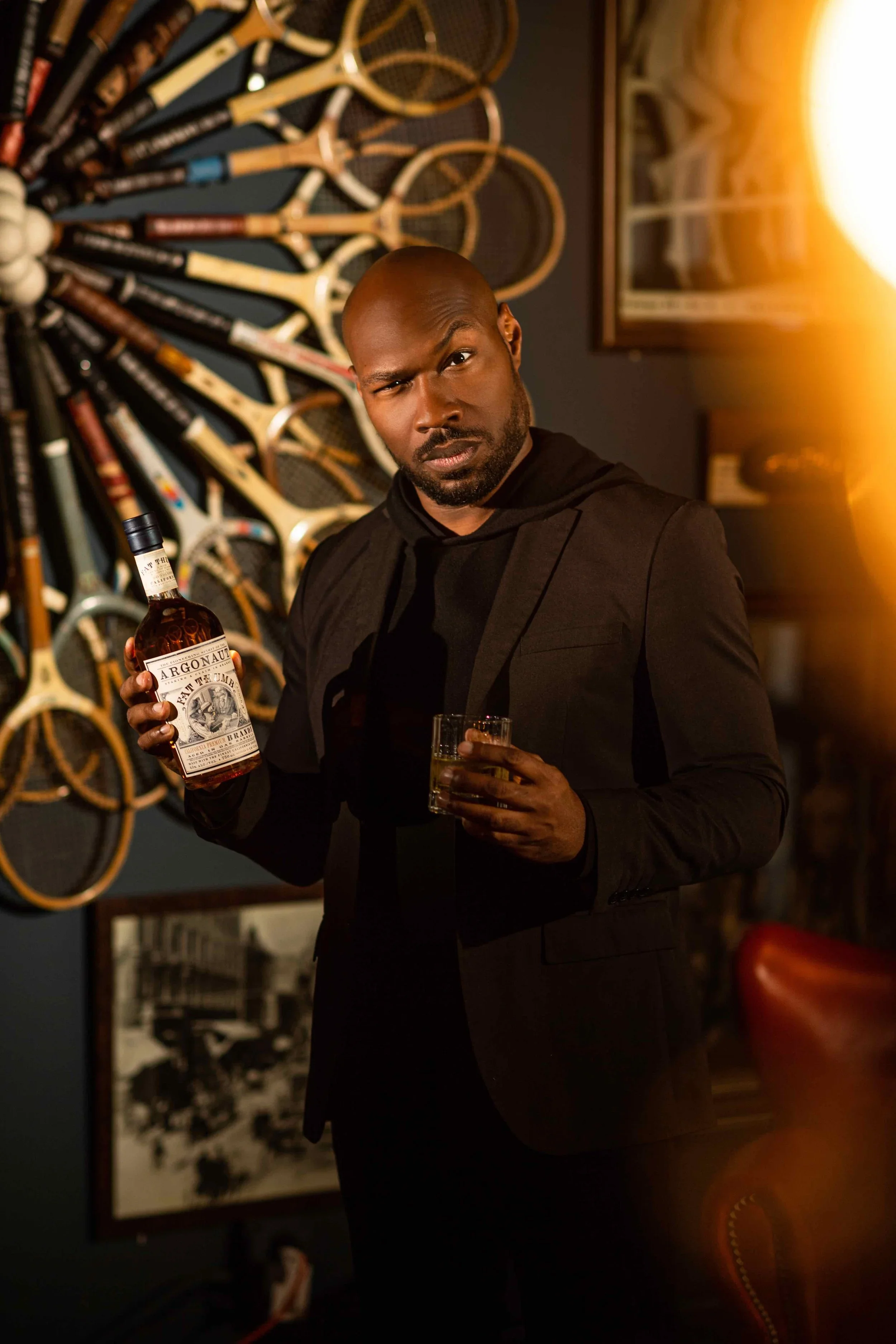 CJ Johnson holding a bottle of Argonaut Fat Thumb brandy