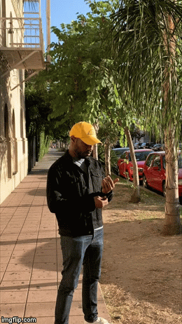 CJ Johnson on a palm-lined sidewalk