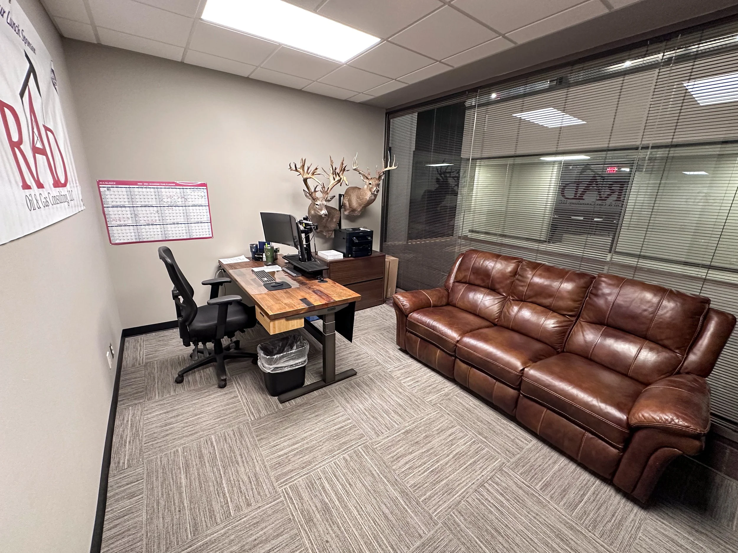 ClayDesta Suite B-111 — desk and leather seating area
