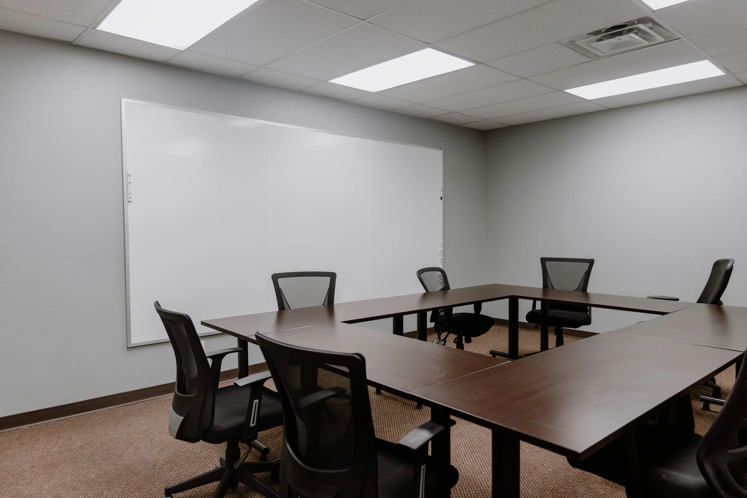 Downtown meeting room — alternate angle with whiteboard