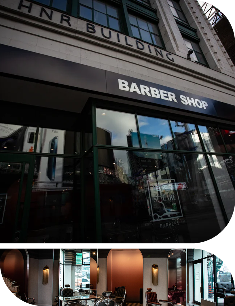 Barber shop storefront and modern interior featuring styling stations, large mirrors and warm metallic accents.