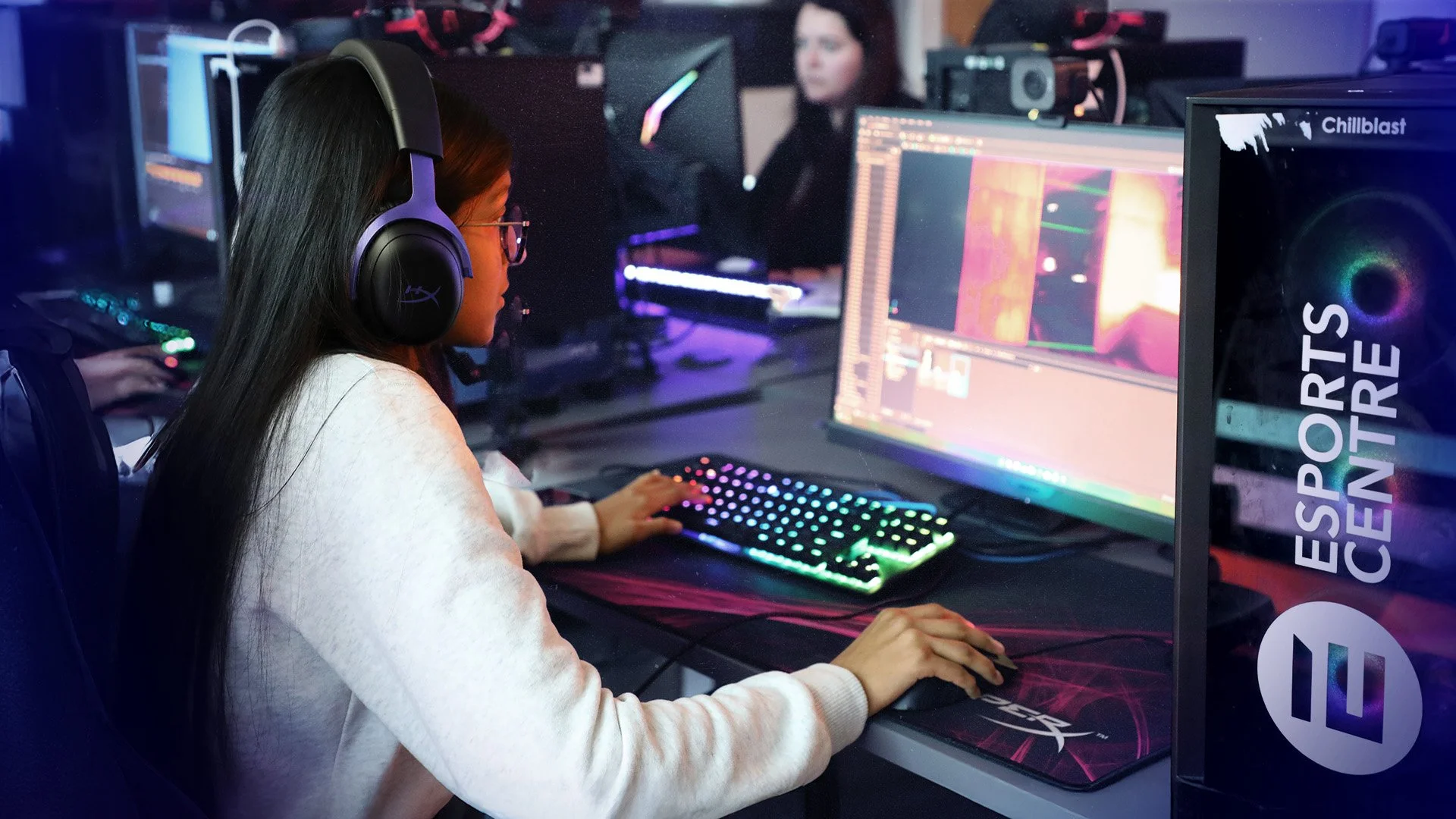 Students gathered in the Warwick Fusion Esports Center, focused on shared screens.