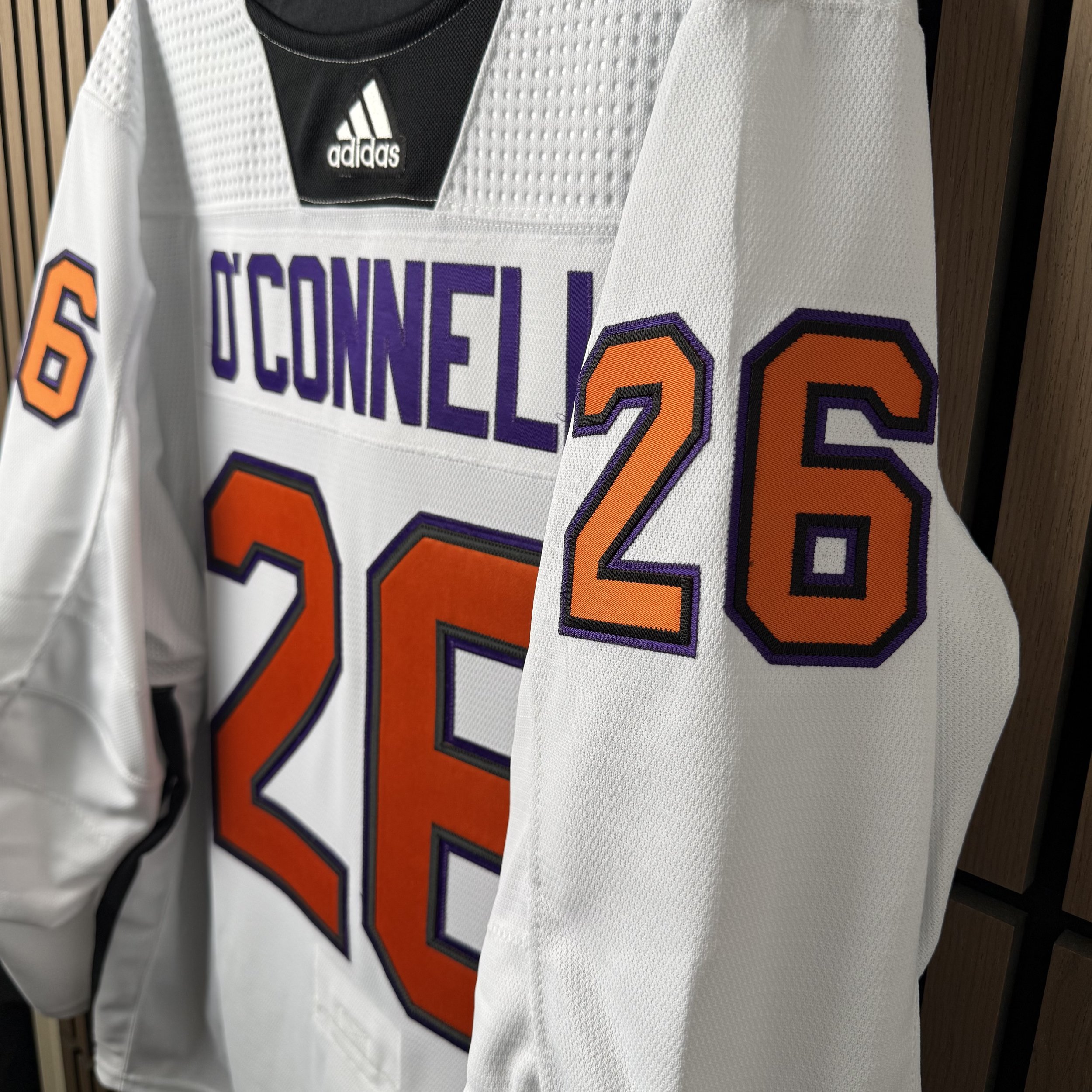 Multi-layer tackle-twill wedding jersey shown at an angle