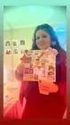 A participant holding up a colorful collage.