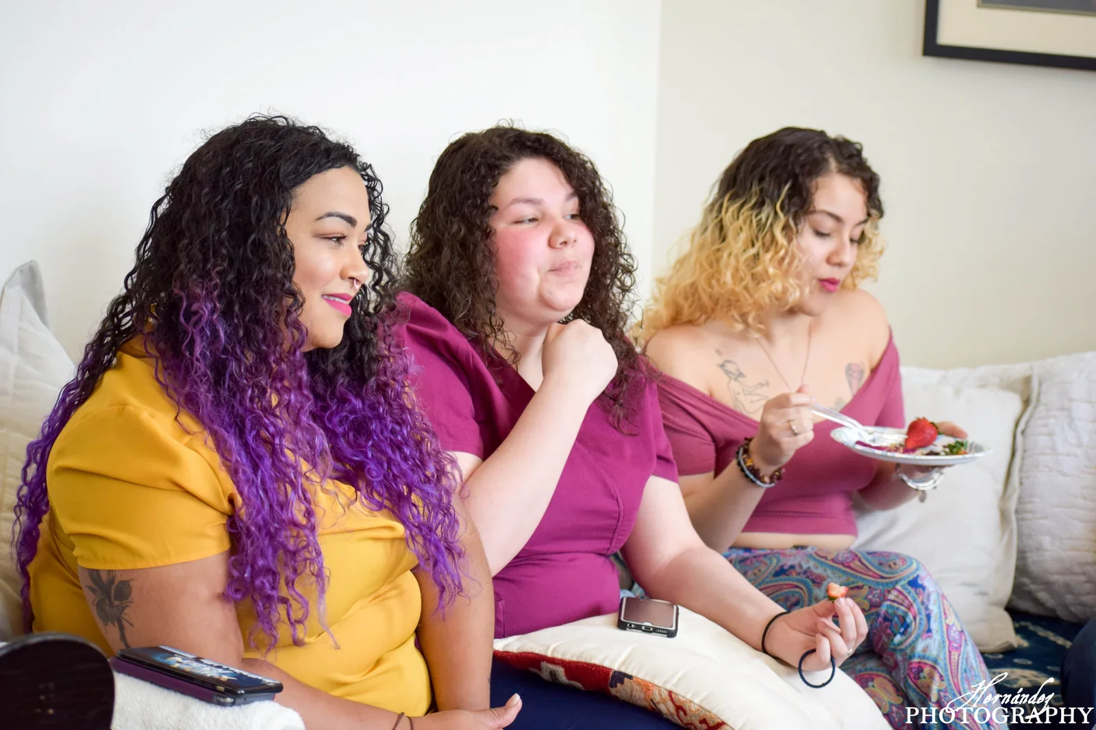 Three participants sharing a conversation on a couch.