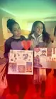 Two participants displaying their collage artwork.