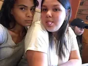 Two participants posing together at an indoor gathering.