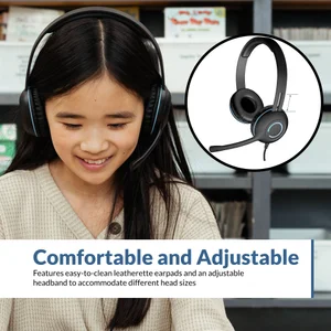 Young student smiling while wearing AC-5008 USB-A stereo headset with microphone at a classroom desk — adjustable headband and leatherette earpads accommodate K-12 head sizes