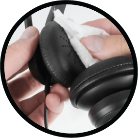 Hand wiping a call center headset earcup and earpad with an alcohol wipe