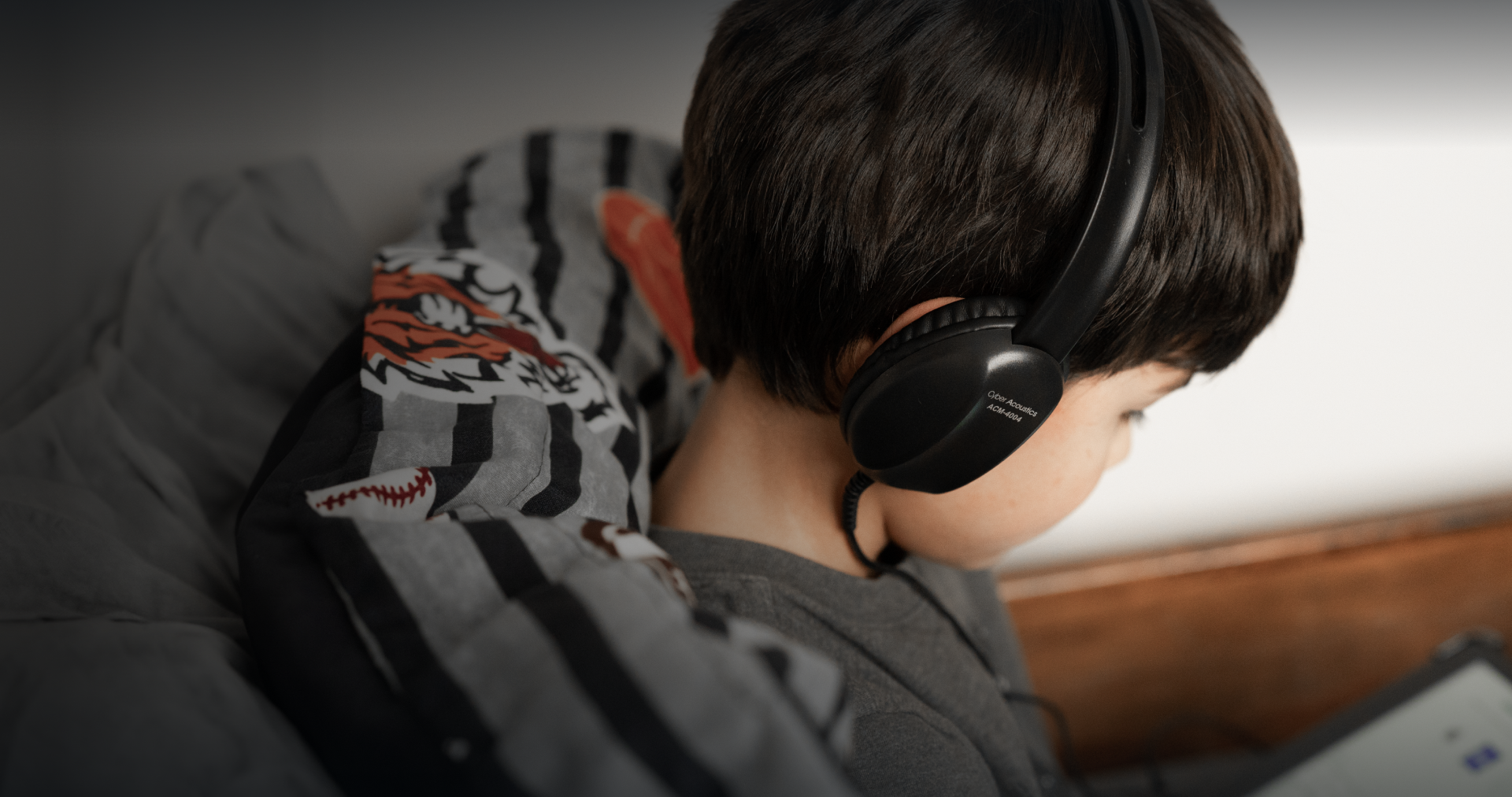 student studying at home with headphones on