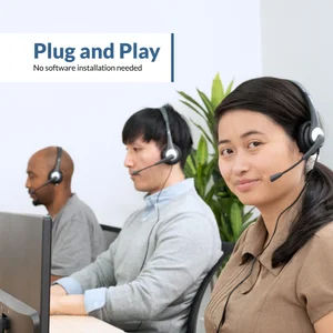 Three office workers wearing AC-104 mono PC headsets at desktop computers — plug and play wired headset requires no software or drivers, works instantly on Windows PCs and school computer lab desktops