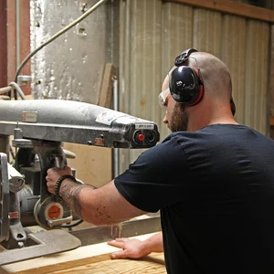 A factory worker wearing cyber acoustics hearing protection