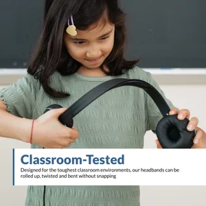 Student bending and twisting the AC-5008 headband in front of a chalkboard — classroom-tested USB-A stereo headset with microphone built to roll, twist, and flex without snapping