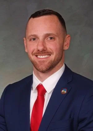 Official portrait of Representative Jarvis Caldwell, serving Colorado House District 20 in El Paso County; Air Force veteran, Minority Leader, focused on public safety and parental rights.