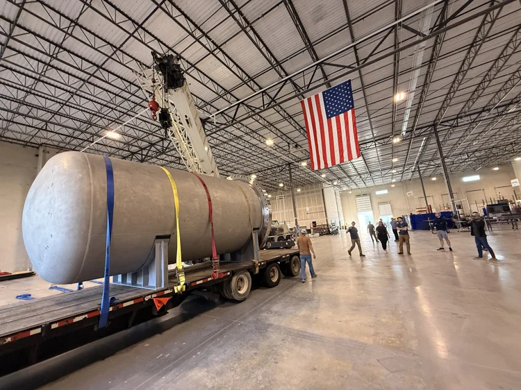 Close-up view of a modern architectural dome with curved metallic panels reflecting light, symbolizing innovation and forward-looking technology.