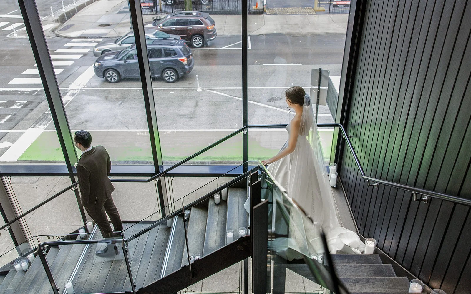 Couple portrait against warm wood arches