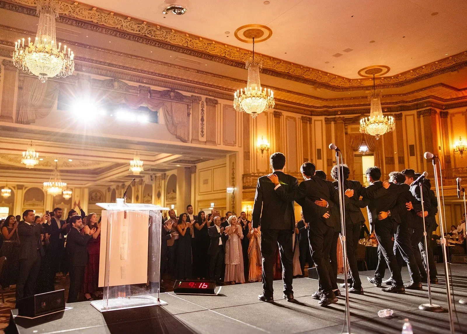 Pratham Chicago Gala — John Legend performing, editorial event photography in warm stage light