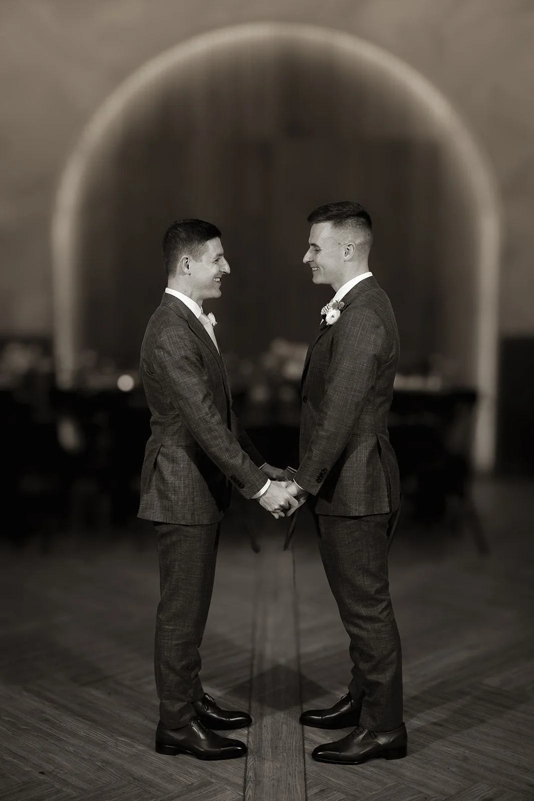 Toasts during reception against wood slat wall