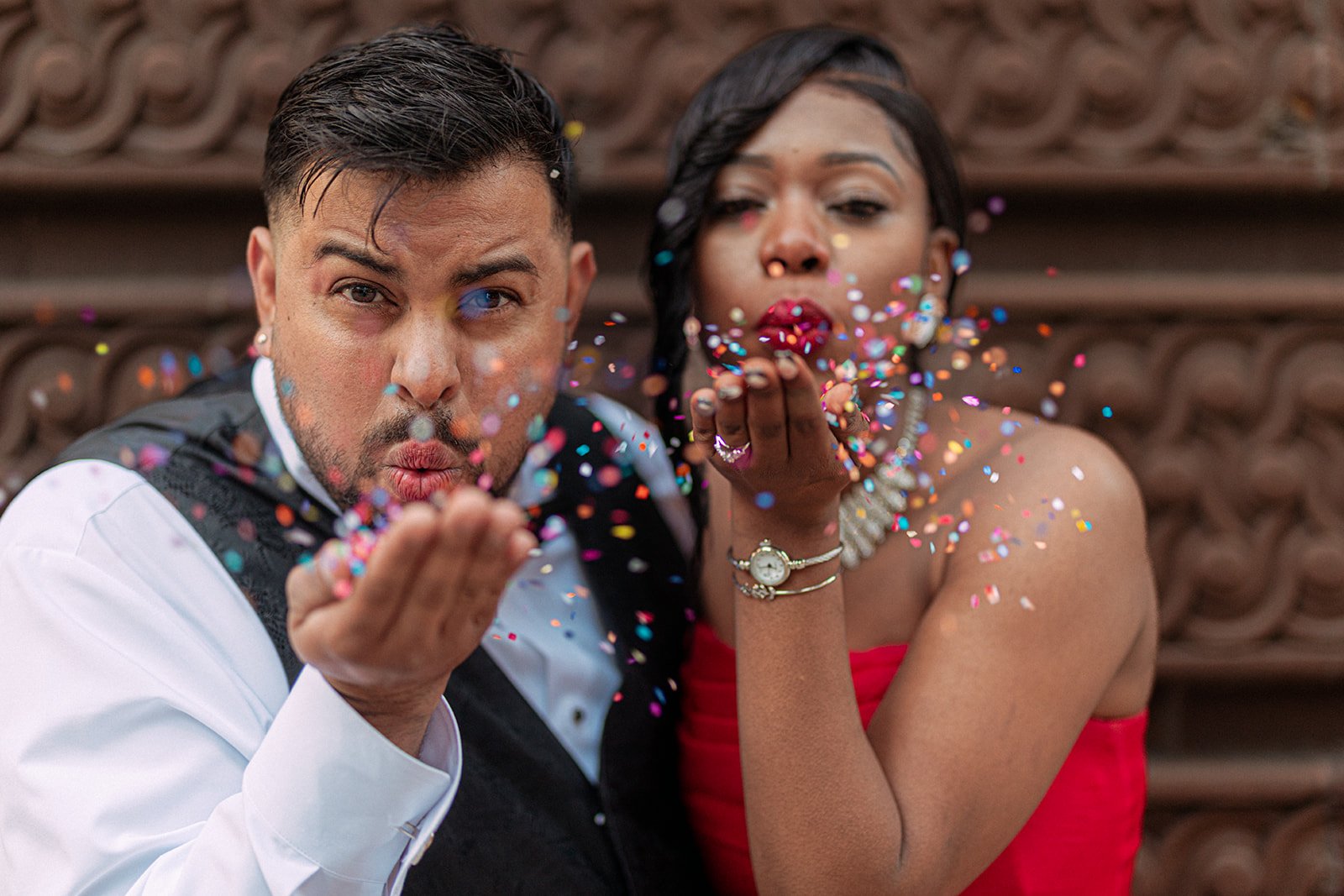 Engaged couple laughing during post-proposal portraits in The Loop, Chicago, photographed by Jeremy Glickstein