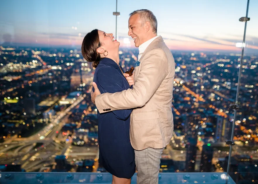 Chicago proposal photographer capturing romantic Skydeck engagement with skyline backdrop