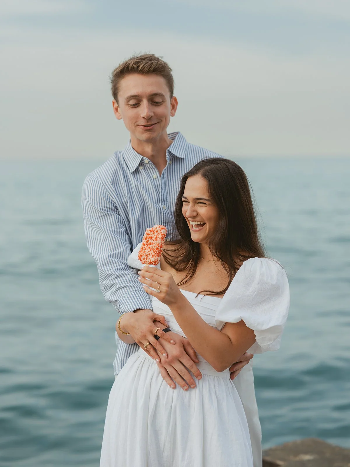 A quiet moment after the surprise proposal at Oak Street Beach