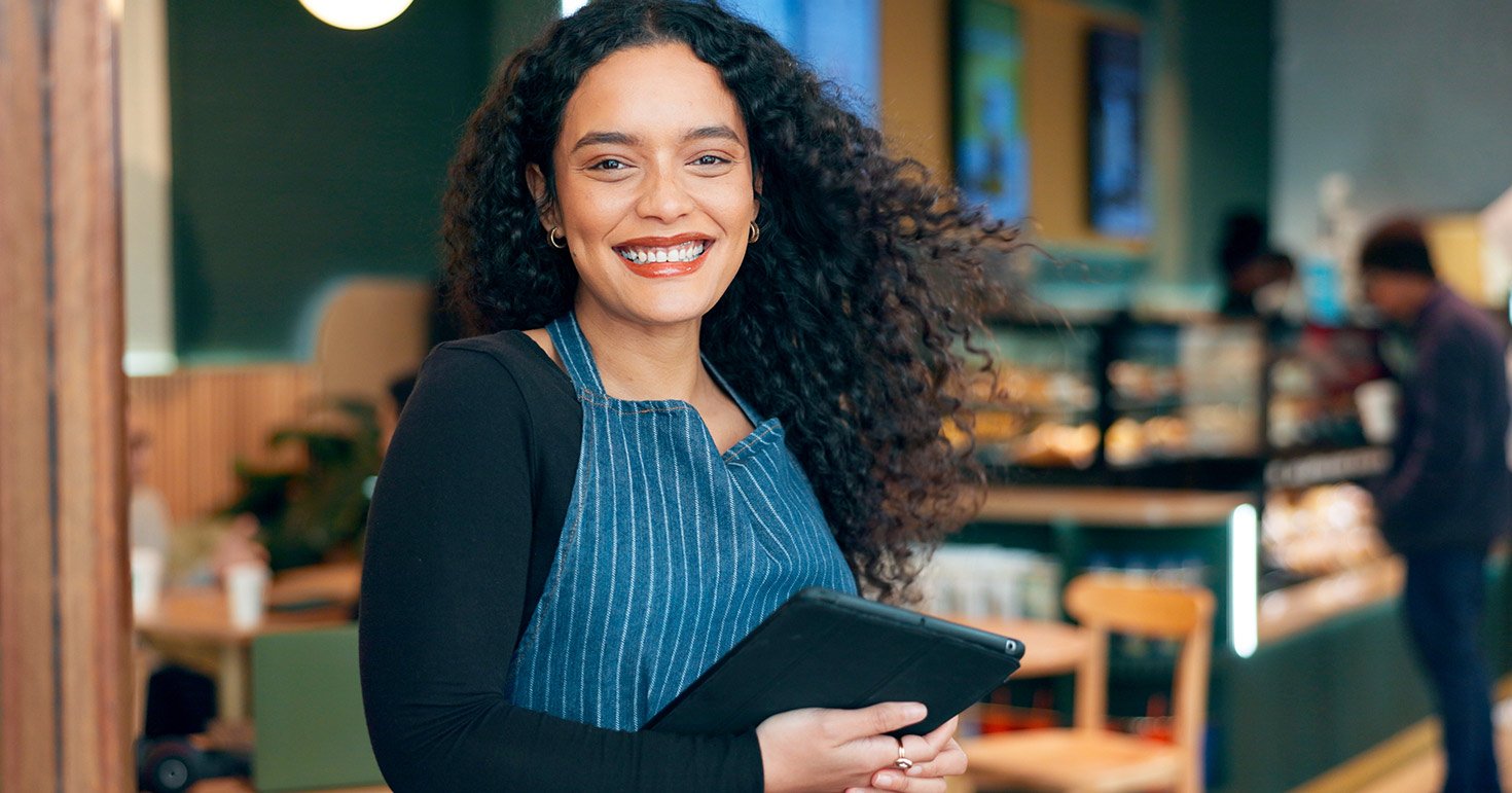 server at restaurant with menu in hands