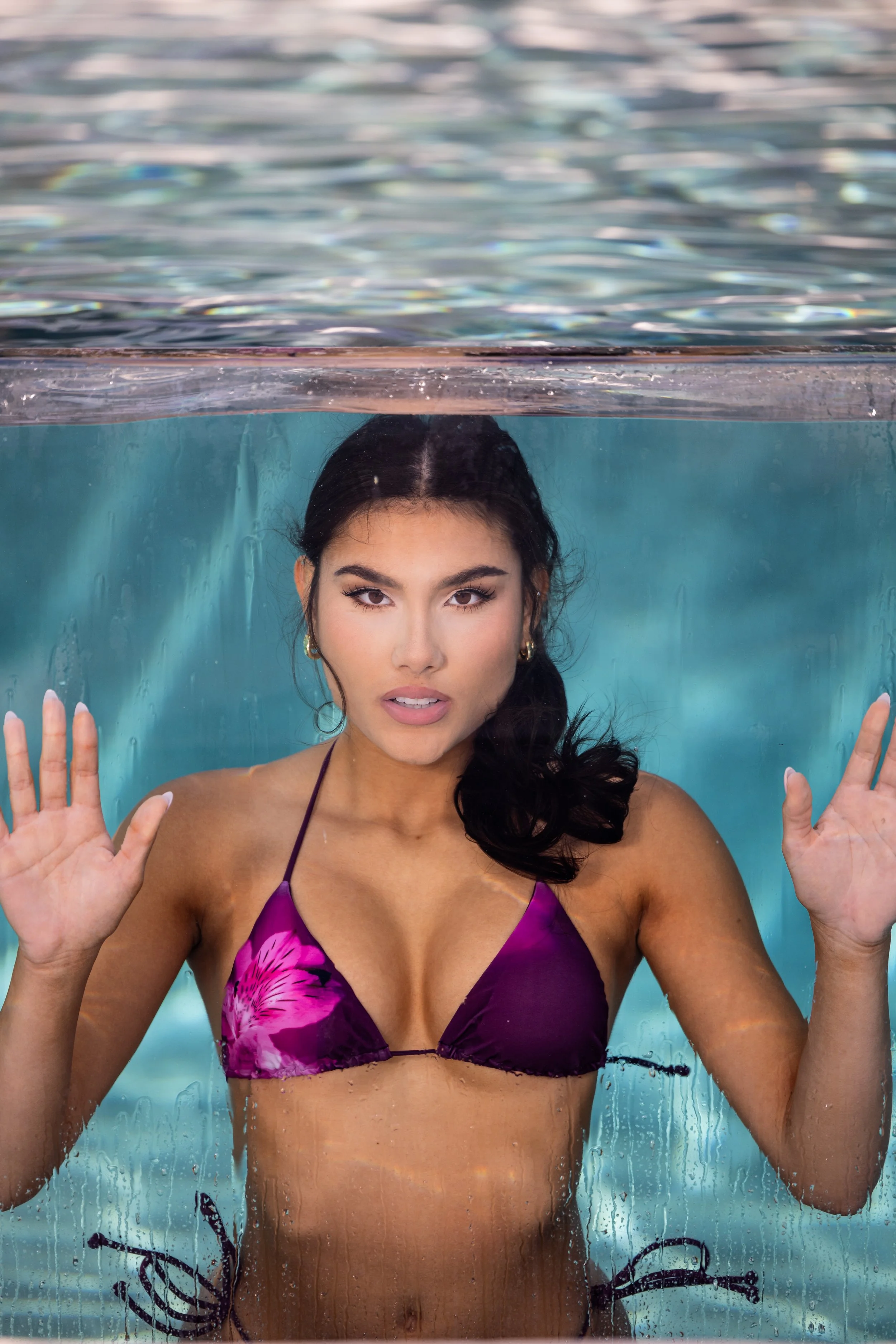 Kiana Mahabir underwater during her Hooters Calendar photo shoot