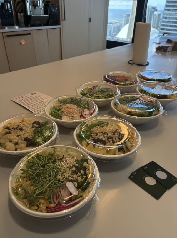 Pokerrito bowls lined up on an office table for a downtown Toronto team