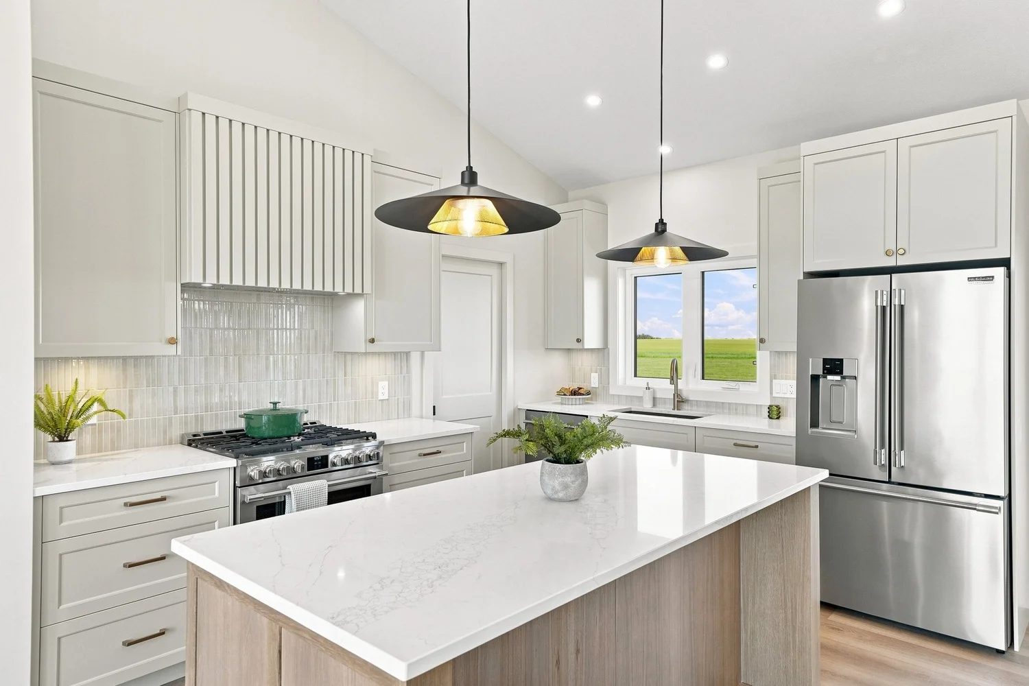 Bright kitchen with an island and pendant lighting