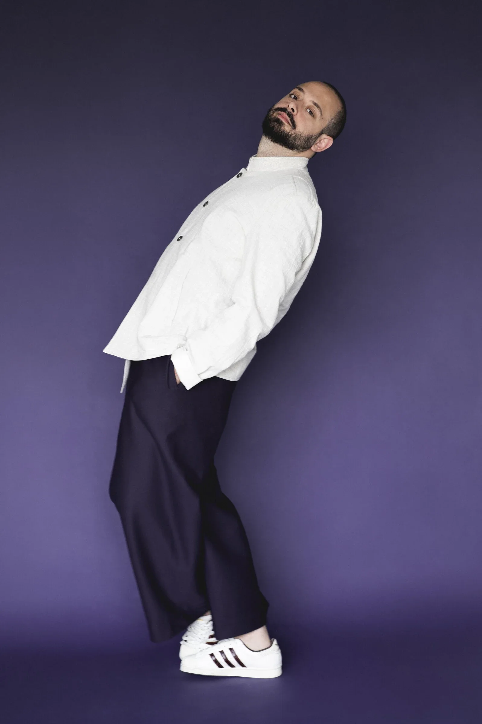 Stathis Karapanos in a white jacket, photographed by Janine Kühn