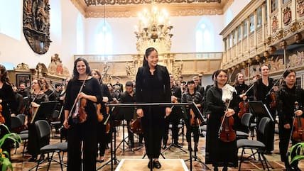 Holly Hyun Choe and the Schleswig-Holstein Festival Orchestra taking applause in the Christkirche, Rendsburg, 15 July 2022.