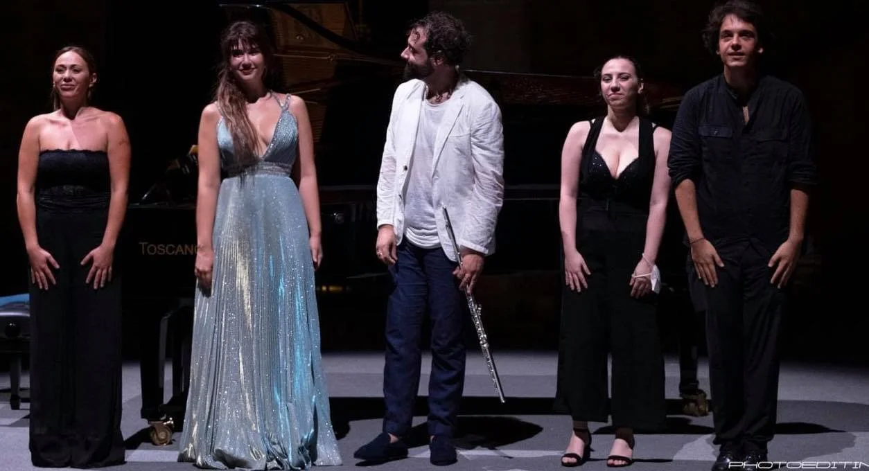 Stathis Karapanos, holding his flute, takes a bow with Nefeli Mousoura and the chamber players at Palermo Classica in 2021.
