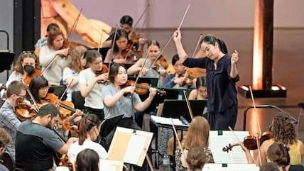 Holly Hyun Choe rehearsing the Schleswig-Holstein Festival Orchestra at the ACO Thormannhalle in Büdelsdorf, July 2022.