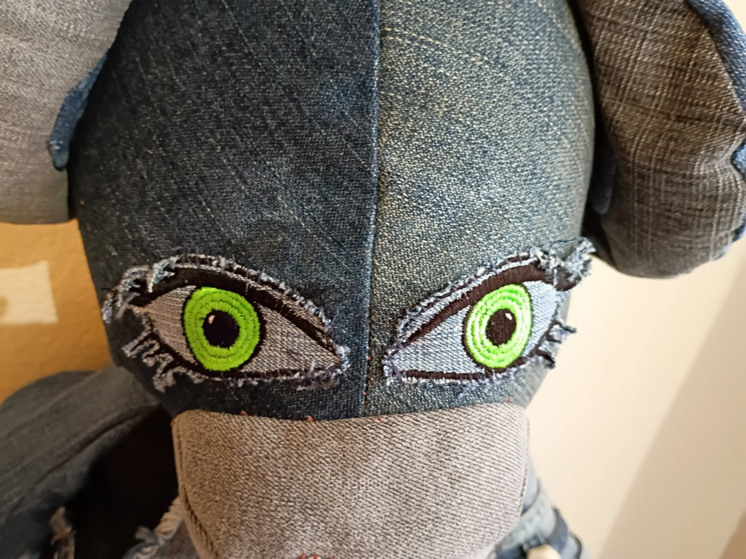 Seraphina's lime green eyes — a close-up detail
