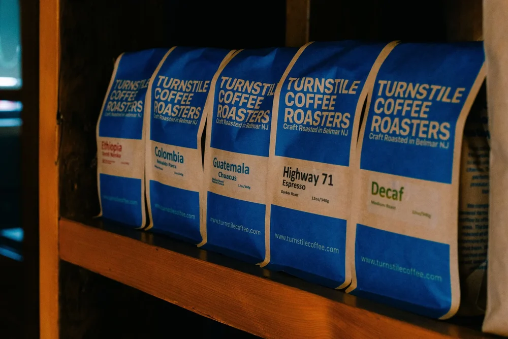 Turnstile retail bags lined up: Ethiopia, Colombia, Guatemala, Highway 71, Decaf