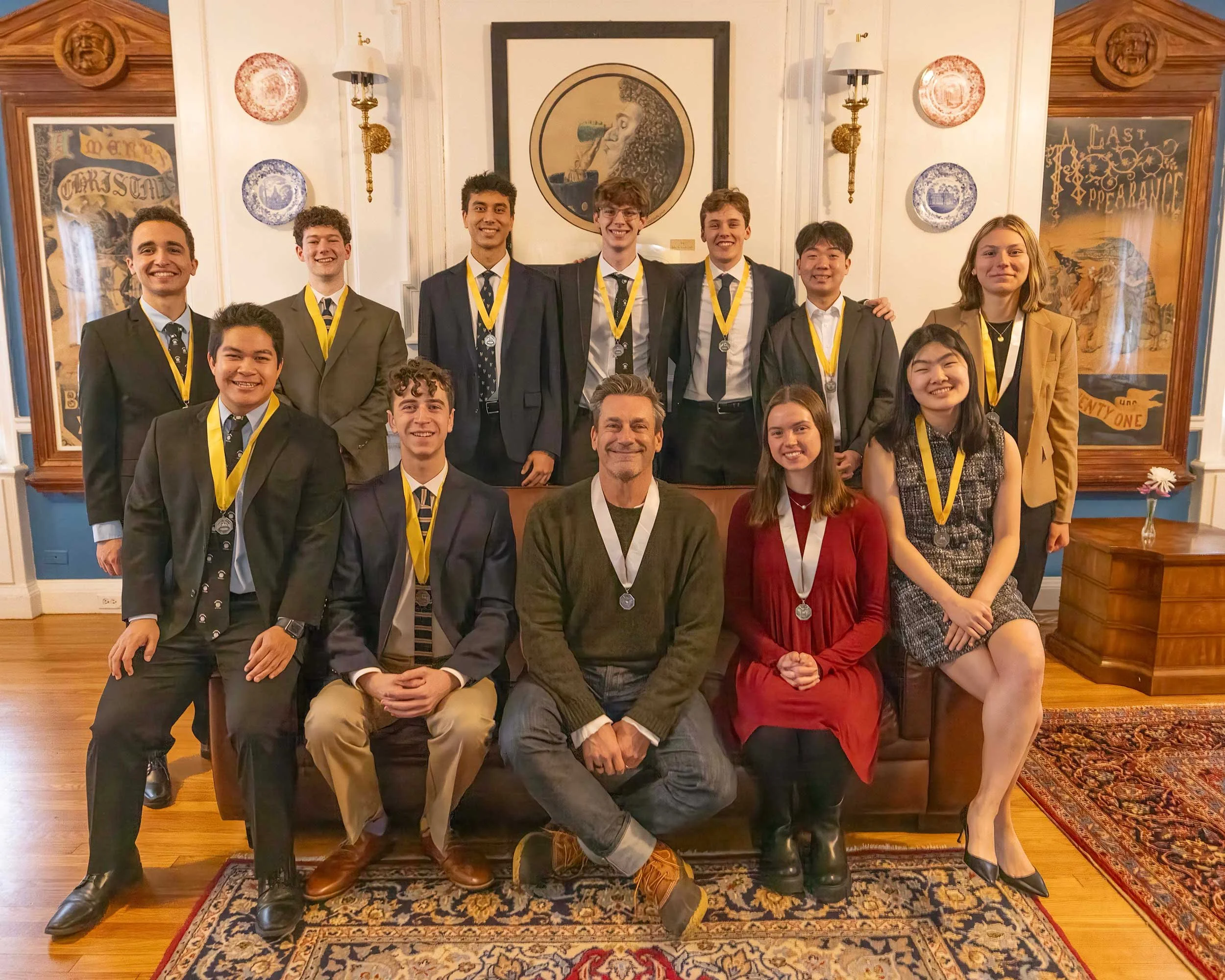 2025 Hasty Pudding Man of the Year band photo featuring Sofia with the Man of the Year performance ensemble.